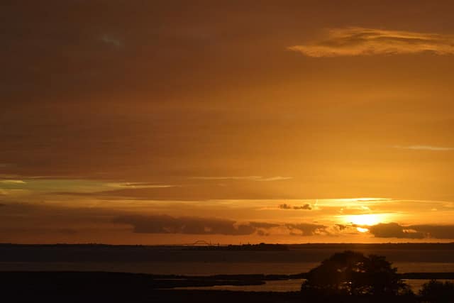 Solnedgang over Møn, her ses øen Lindholm og Dronning Louises bro (Mønbroen) i baggrunden. Efter min mening er det den smukkeste bro i Danmark.